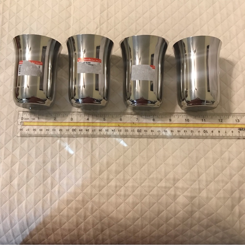 NWT stainless steels bell shaped tumblers. Set/4. Butterfly engraved on bottom.